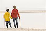 Mother and son on beach with fishing net