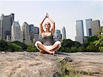 Woman doing yoga in central park