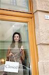 woman with closed sign