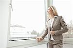 Businesswoman looking out window