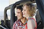 Couple smiling in jeep
