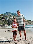 Father and son on a beach with ball