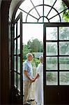 Mature couple by french doors