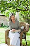 Mature woman reading book