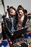 Disc jockey at party on mixing desk