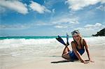 Woman at water's edge, Mustique, Grenadine Islands