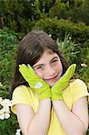 Girl wearing gardening gloves, portrait