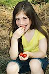 Girl eating cherry tomatoes