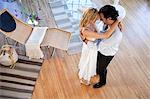 Couple dancing at home, high angle view