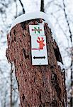 Sign on tree trunk