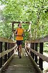 Man running along boardwalk