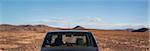 Car in stony desert, Morocco, North Africa