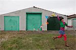 Young woman running with bunting