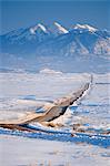 Ranch road in winter, La Sal Mountains, Utah, USA