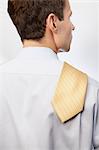 Young man with tie over shoulder