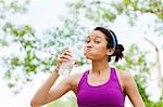 Young woman drinking mineral water