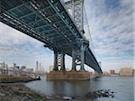 View of Manhattan from under the Manhattan Bridge, from Main Street Park in winter, New York City, New York, USA