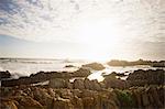 Waves crashing over rocks on beach