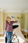 Woman drinking water in new home