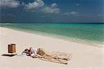 Man sleeping in bed on beach