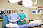 Surgeon and nurses in operating room