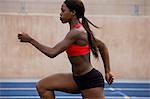 Woman running on track