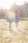 Girls walking together in field