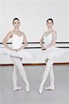 Ballet dancers posing together in studio