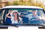 Newlywed couple riding in car