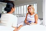 Women having coffee in living room