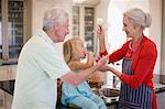 Family cooking together in kitchen