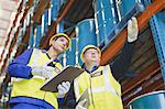 Workers talking in warehouse