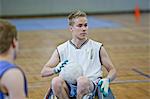 Man in wheelchair playing pararugby