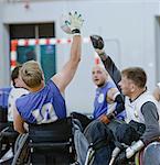 Men in wheelchairs playing pararugby