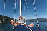 Older man relaxing on sailboat