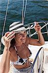 Woman relaxing on sailboat