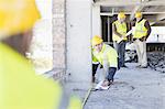 Worker measuring space on site