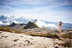 Girl walking in rocky landscape