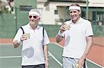 Older men drinking lemonade on court