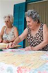 Older women making pasta together