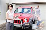 Family washing car together