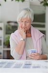 Older woman playing cards