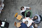 Overhead view of business people at desk