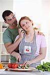 Man holding phone for cooking girlfriend