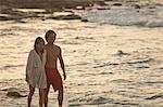 Couple walking together on beach