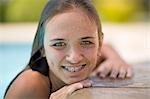 Teenage girl in braces relaxing in pool
