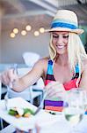 Woman serving herself in cafe