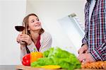 Couple cooking together in kitchen