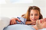 Smiling couple relaxing in bed