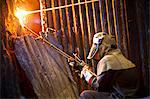 Welder at work in steel forge